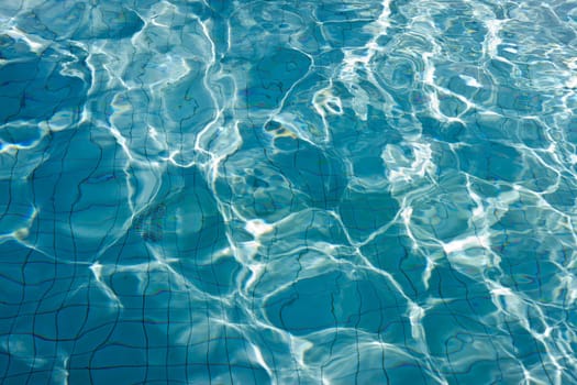 The Most beautiful clear pool water reflecting in the sun