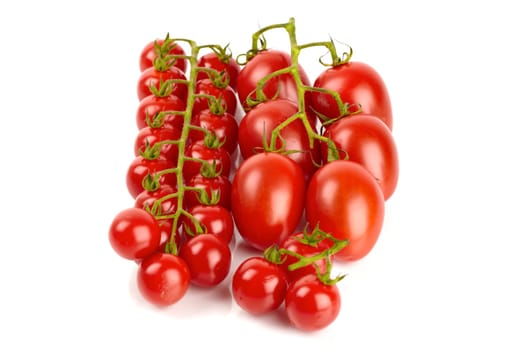 Cherry and Roma tomatoes isolated against white background