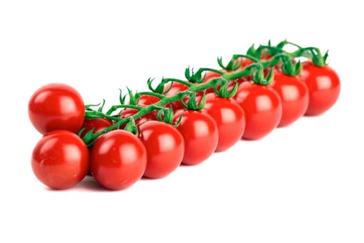 Cherry tomatoes isolated against white background