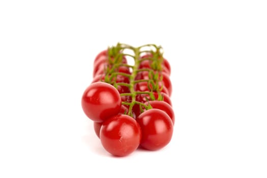 Cherry tomatoes isolated against white background