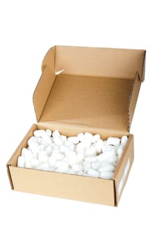 Cardboard box opened with packaging material against white background
