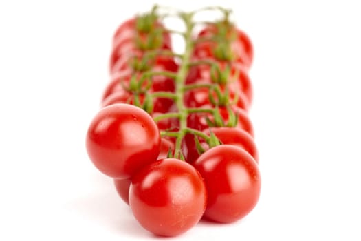 Cherry tomatoes isolated against white background