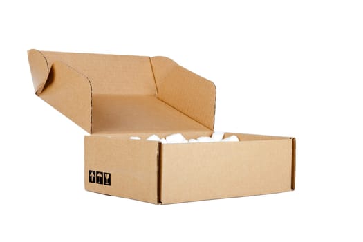 Cardboard box opened with packaging material against white background