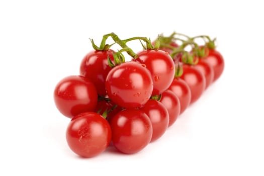 Cherry tomatoes isolated against white background