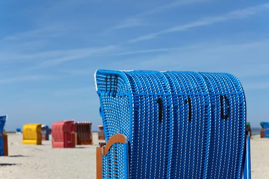 Blue single beach chair on the beach of the Baltic Sea