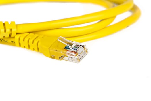 Yellow network cable against white background