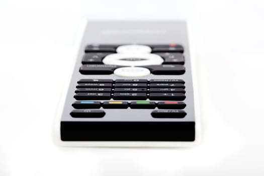 Modern black and white remote control against white background