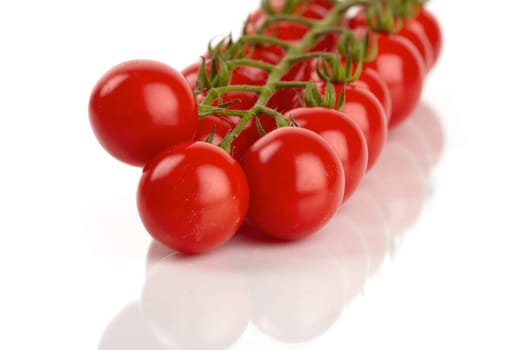 Cherry tomatoes isolated against white background