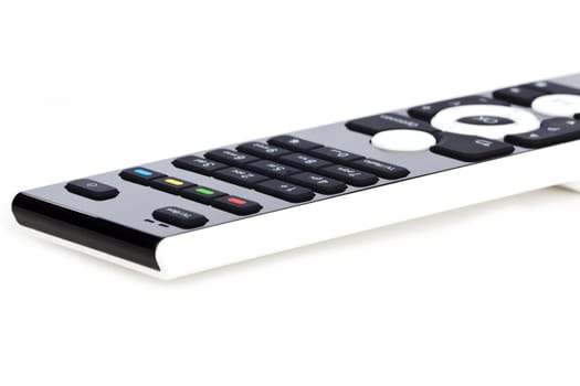 Modern black and white remote control against white background