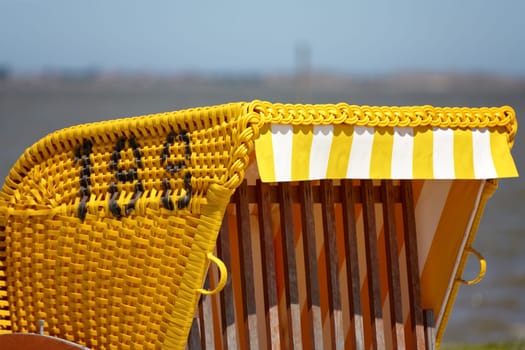Yellow beach chair on the beach of the Baltic Sea