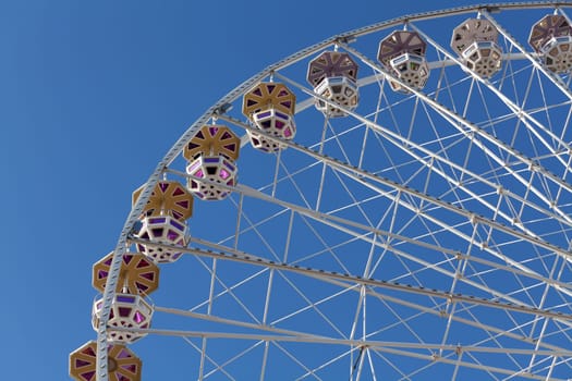 Ferris wheel,attraction at the funfair and view on a ride