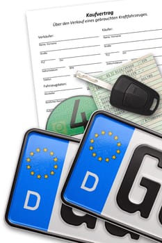 License plates,car keys and documents on white background.