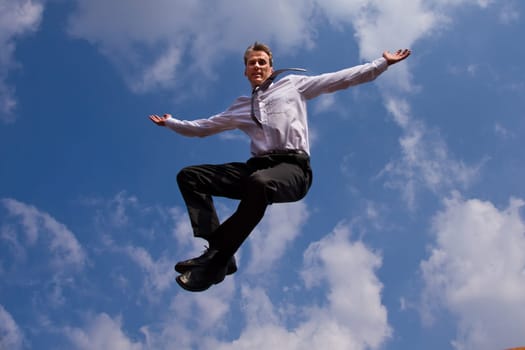 A businessman's leap of joy