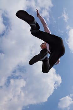 A businessman's leap of joy