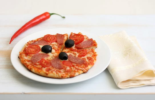 Pizza arrabiata with salami