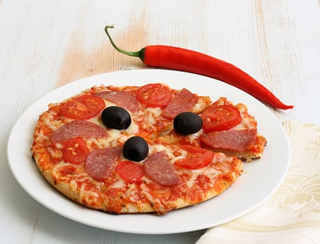 Pizza arrabiata with salami