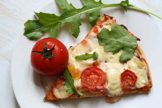 Pizza with cheese and rocket