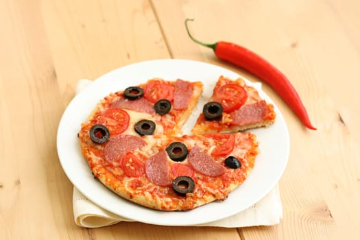 Pizza arrabiata with salami