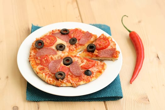 Pizza arrabiata with salami