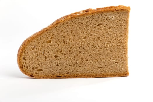 A slice of farmhouse bread on a white background