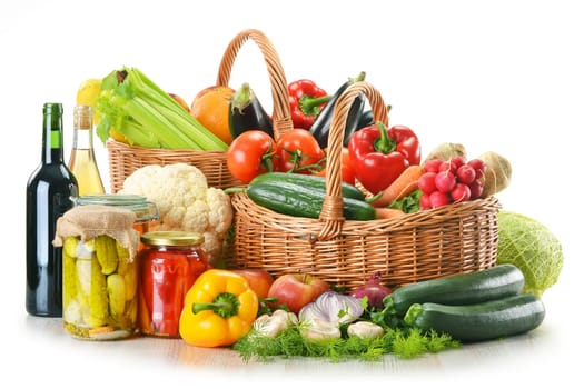 Composition with wicker basket and grocery isolated on white