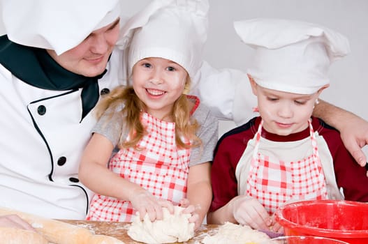 chef and children in the chefs prepare a meal