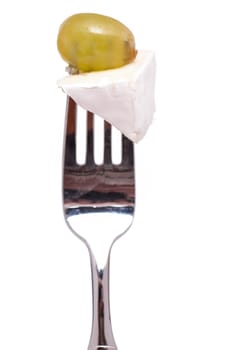 A gable with a piece of Camemberg and a grape