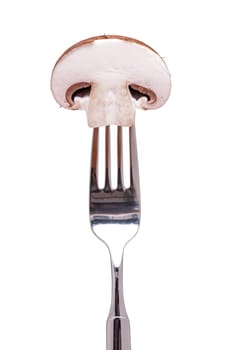 A fork with a piece of brown mushroom