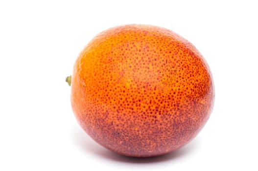 A citrus blood orange against a white background