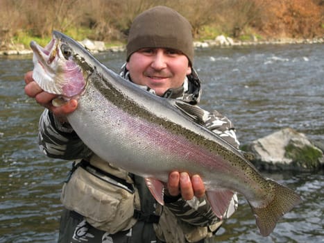 Fisherman catched big trout