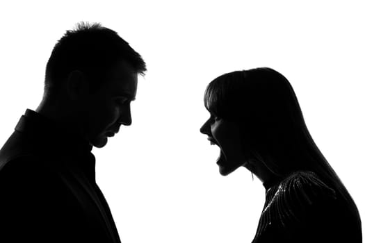 one caucasian couple man and woman face to face screaming shouting dipute in studio silhouette isolated on white background