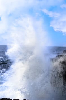 cliffs and coastline of the burren in county clare ireland with giant waves crashing on the rocks