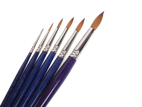 Group of brushes over white