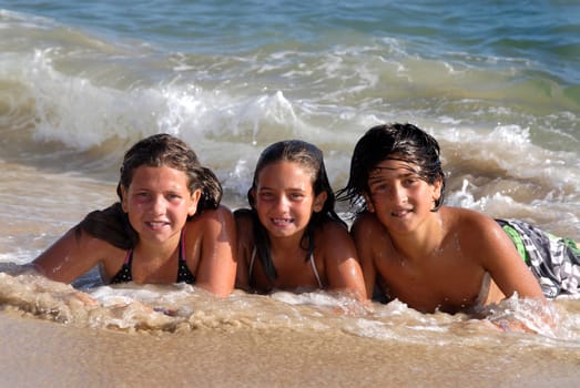 Siblings having fun on the beach