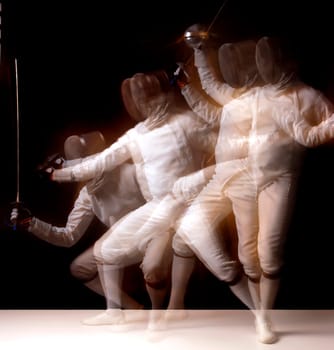 Male fencer isolated in a dark background