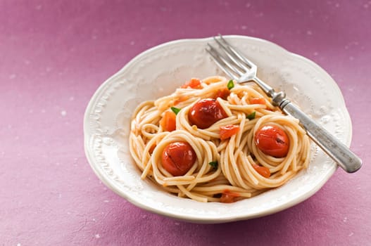 Fresh spaghetti with tomato sauce close up