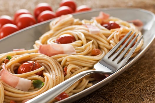 Fresh spaghetti with tomato sauce close up