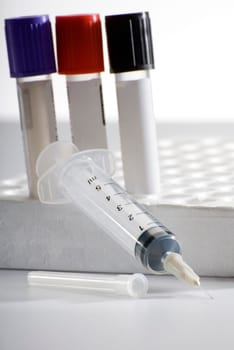 medical injection with some ampulles in background close up