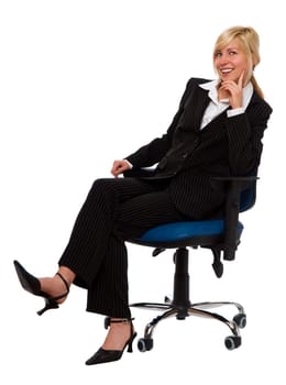 young blond business woman sitting in a chair