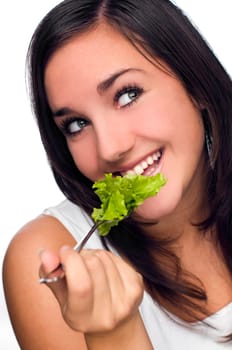 young attractive woman eating salad close up