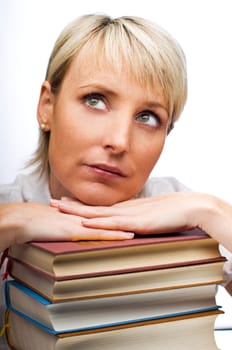 young blond woman with stack of books close up