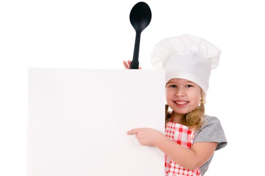 girl in chef&#039 s hat indicates on blank sheet isolated on white background