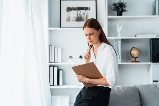 Psychologist woman in clinic office professional portrait with friendly smile feeling inviting for patient to visit the psychologist. The experienced and confident psychologist is utmost specialist