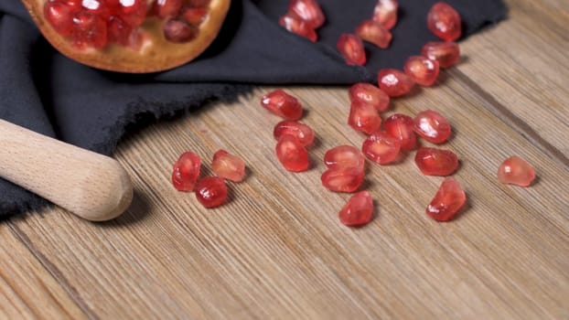 Pomegranate fruit on rustic table in vintage style.