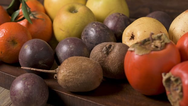 Autumn fruits on rustic table in vintage style.