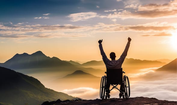 Handicapped male sitting in wheelchair on mountain peak. International Day of Persons with Disabilities (IDPD) concept Silhouette a disabled man in wheelchair raising his hands over mountain background copy space