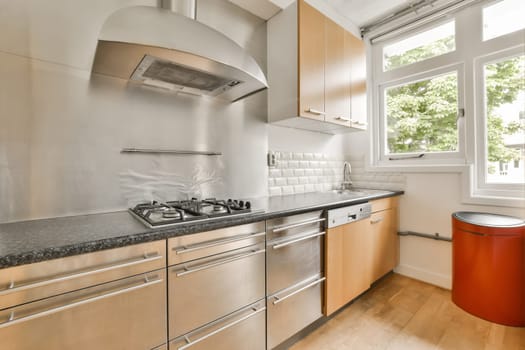 a modern kitchen with stainless steel appliances and wood cabinets in the room is very clean, but it's all white