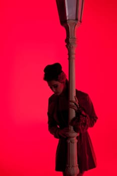 beautiful young glamorous woman  with lightpole