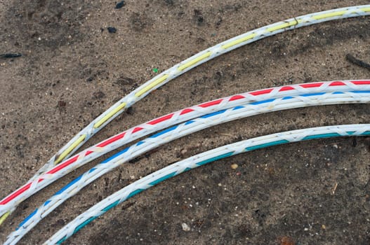 green fiber cable ready to go into the ground on a newly build industrial area