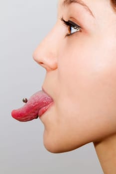 Tongue piercing in profile
